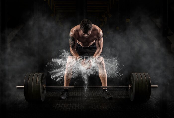 Fototapete Mann bereitet sich auf das Training vor