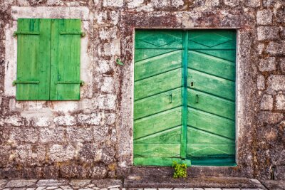 Fototapete Mauer mit grüner Tür