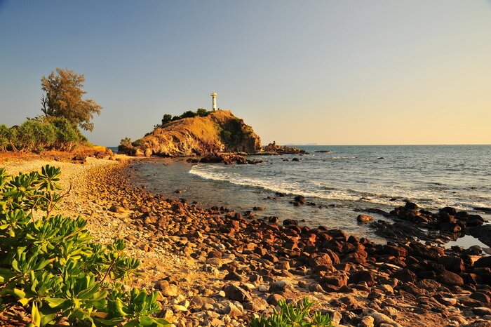 Fototapete Meer und Leuchtturm bei Sonnenuntergang