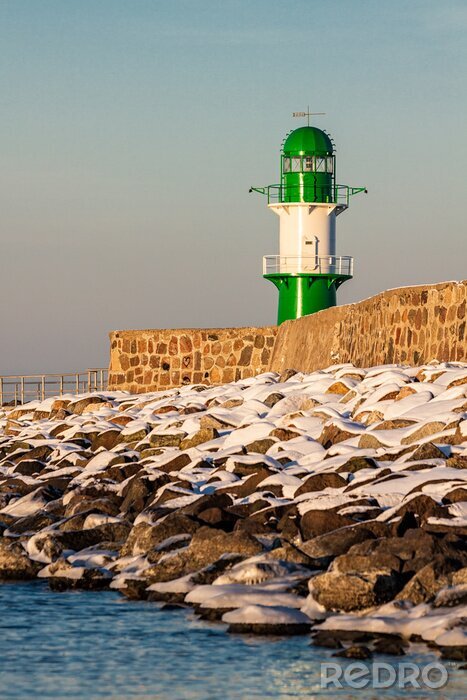 Fototapete Meer und Leuchtturm im Winter