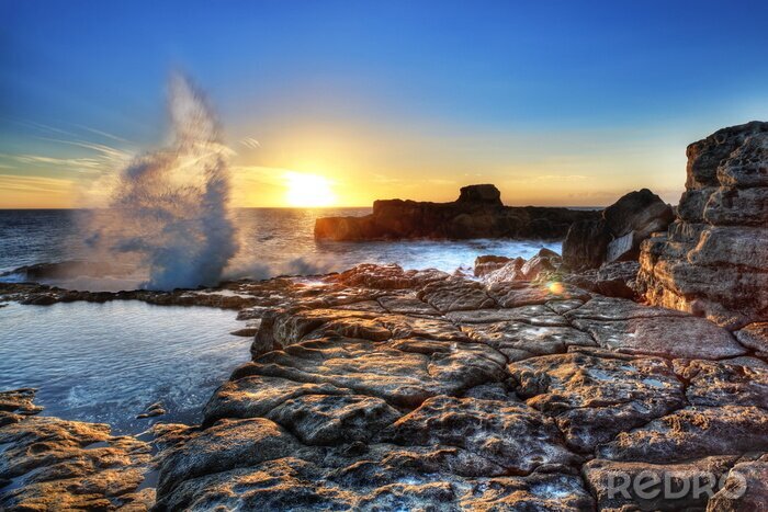 Fototapete Natur der auf die Felsen treffenden Wellen