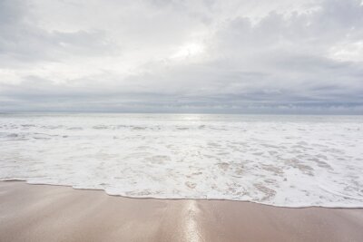 Fototapete Ocean, sea, sand beach with black clouds on horizon. Zen picture (France-Vendée-Les Sables-d'Olonne)