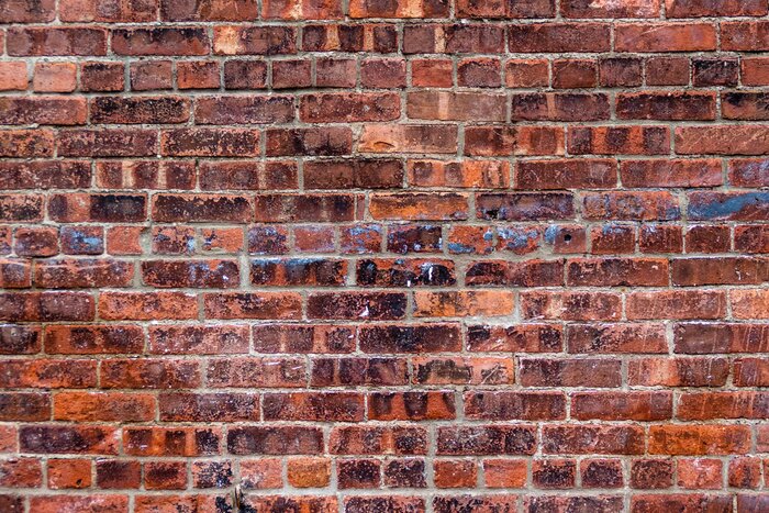 Fototapete Orange-braune Ziegelmauer
