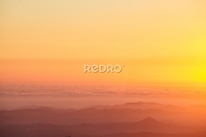 Fototapete Orange Himmelsaura bei Sonnenuntergang
