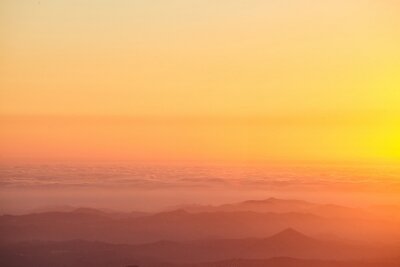 Fototapete Orange Himmelsaura bei Sonnenuntergang