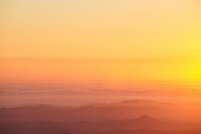 Fototapete Orange Himmelsaura bei Sonnenuntergang