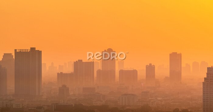 Fototapete Orangefarbener Aura-Sonnenaufgang über dem Stadtbild
