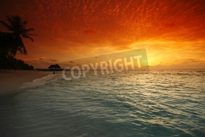 Fototapete Orangefarbener Himmel über Strand