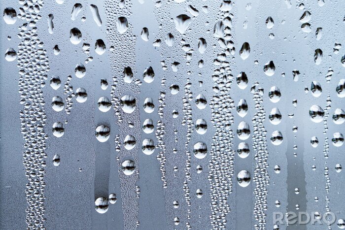 Fototapete Regentropfen auf einer Glasfläche
