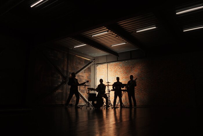 Fototapete Rockband im Schatten