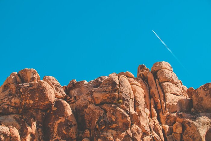 Fototapete Rote Felssteine vor dem Hintergrund des Himmels