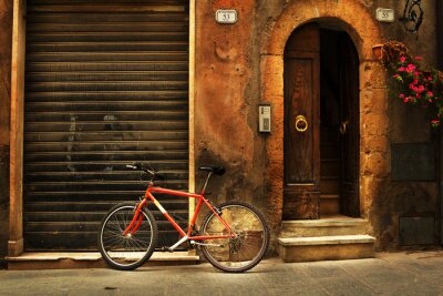 Fototapete Roter Fahrrad bei Mauer