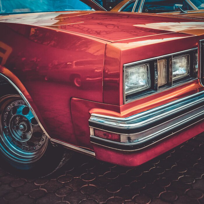 Fototapete Rotes Auto mit Weinlese-Effekt