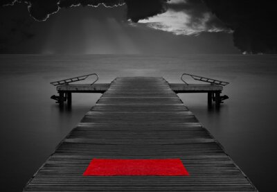 Fototapete Schwarz-weißer Steg mit rotem Handtuch