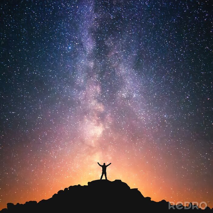 Fototapete Silhouette einer Person vor einem galaxienartigen Weltraumhintergrund