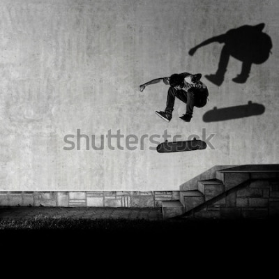 Fototapete Skater macht einen Trick über die Treppe