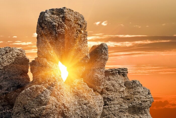 Fototapete Sonne zwischen den Felsen