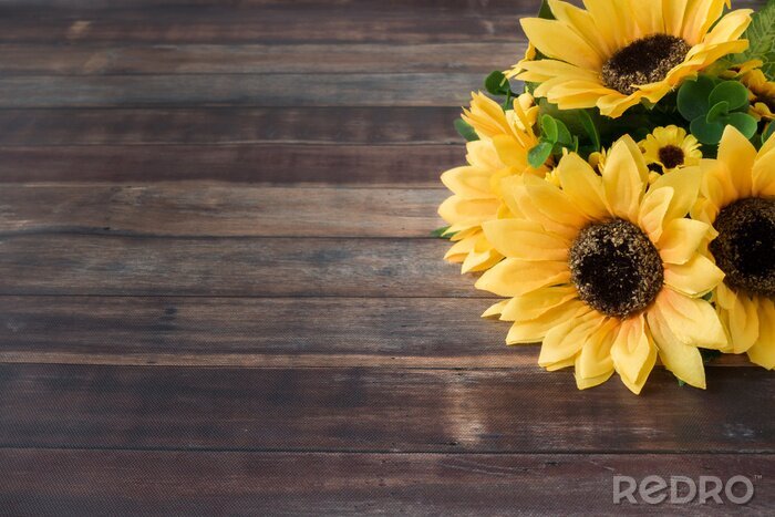 Fototapete Sonnenblumenstrauß auf Holz