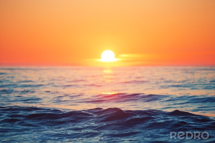 Fototapete Sonnenuntergang über Ozean und Wellen