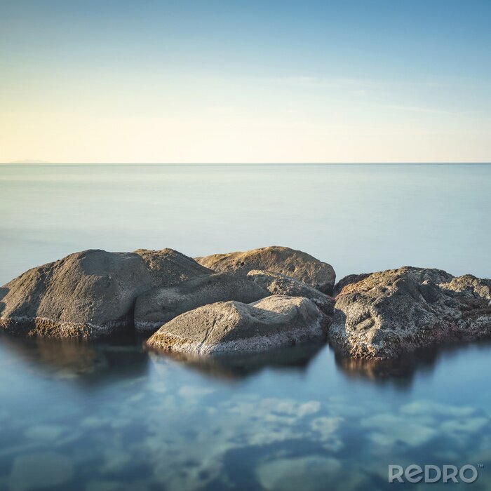 Fototapete Steine im ruhigen Meer