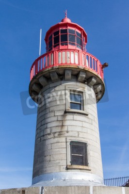 Fototapete Steiniger Leuchtturm mit rotem Schmuckrand