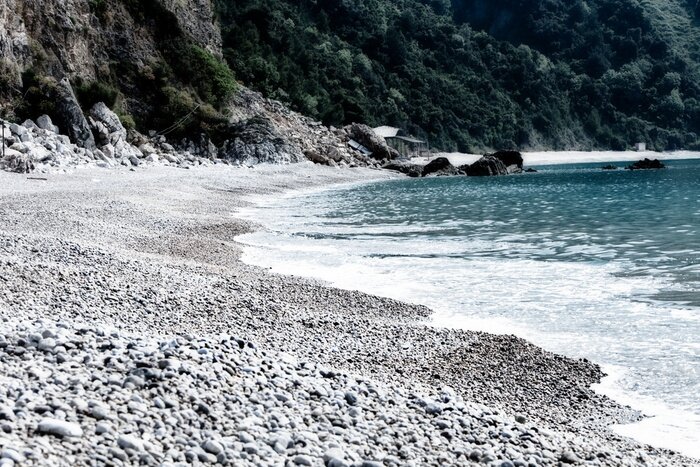 Fototapete Steinstrand im Sommer