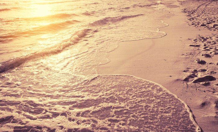 Fototapete Strand und Wellen in Sonnenstrahlen