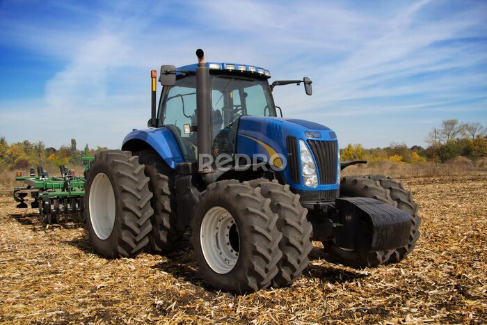 Fototapete Traktor auf einem Feld