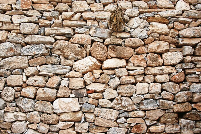 Fototapete Unregelmäßige steinige Mauer