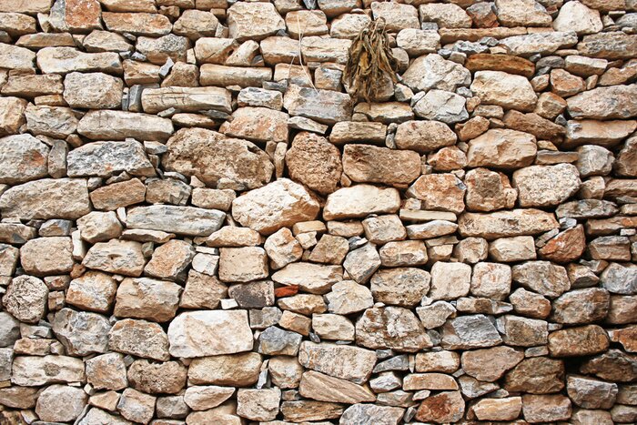 Fototapete Unregelmäßige steinige Mauer