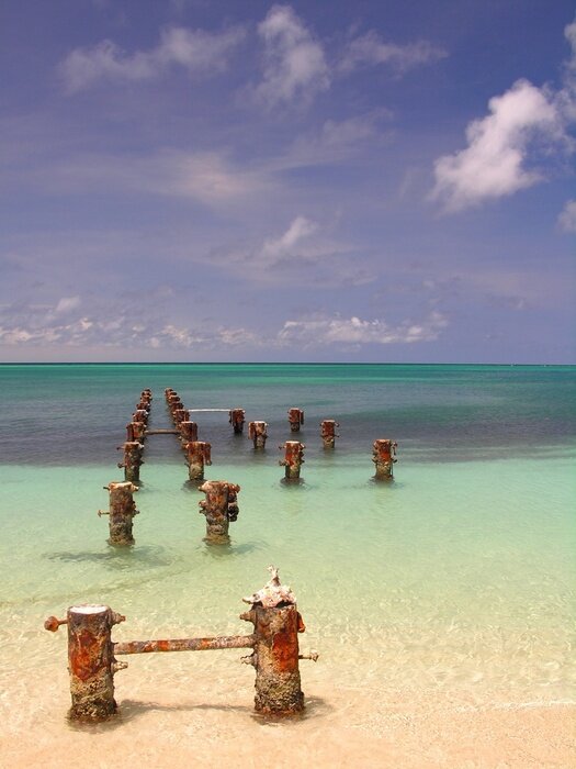 Fototapete Wellenbrecher im türkisfarbenen Meer