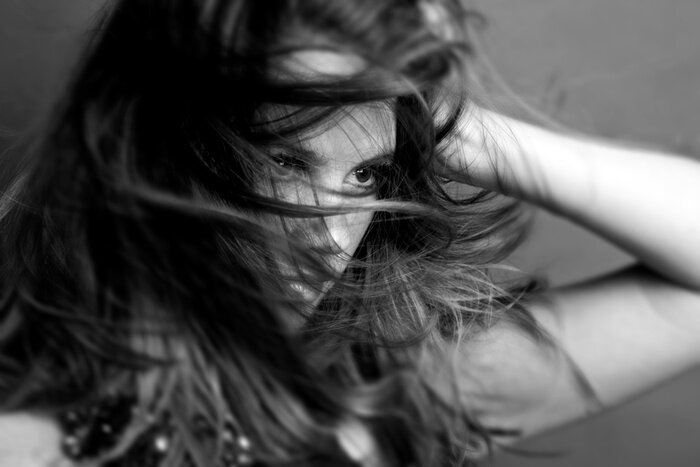 Fototapete Wildes Haar einer Frau