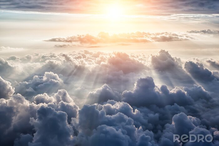 Fototapete Wolken mit Sonne im Hintergrund