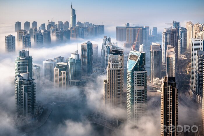 Fototapete Wolkenkratzer Sonnenaufgang im Nebel