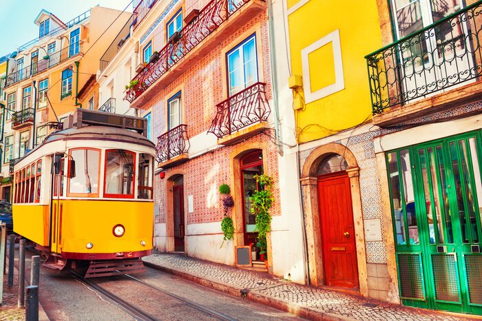 Fototapete Yellow vintage tram on the street in Lisbon, Portugal. Famous travel destination