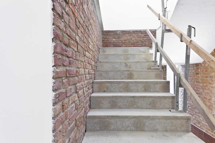 Fototapete Ziegelwand und Betontreppe