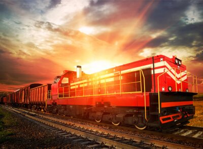Züge und Lokomotiven bei Sonnenuntergang