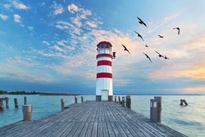 Fototapete Zum Sonnenuntergang am Leuchtturm am See
