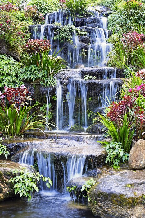 Poster Artificial waterfall and statue at the garden