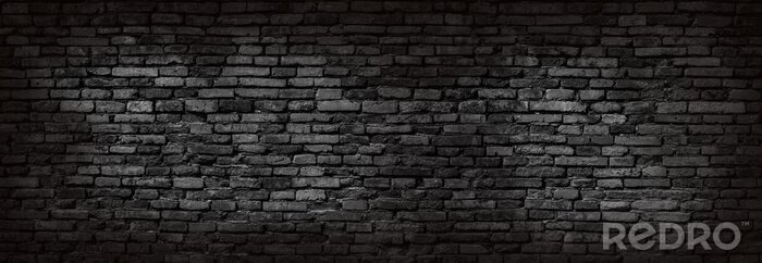 Poster Backsteinwand in dunkeler Straße