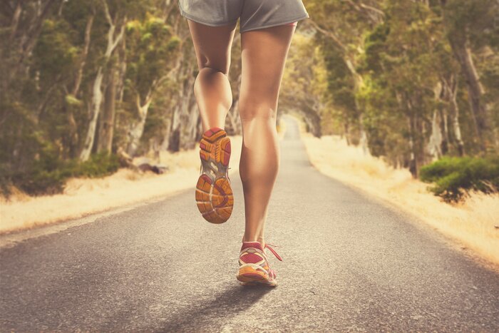 Poster Beine einer Frau beim Joggen