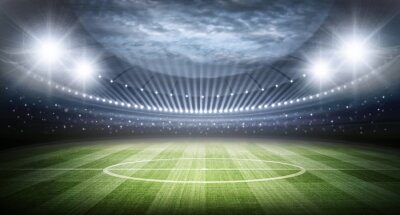 Poster Blick auf das Spielfeld und das von Flutlicht beleuchtete Stadion