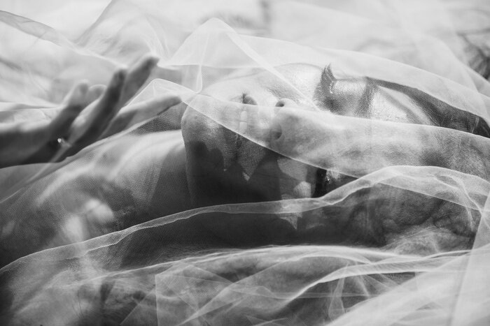 Poster Closeup Sexy Erotic Woman Face under see through fabric with monontone art photography.