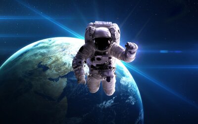 Poster Der Weltraum und ein Astronaut im Zustand der Schwerelosigkeit