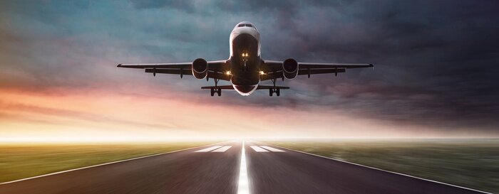 Poster Ein Flugzeug landet auf der Landebahn