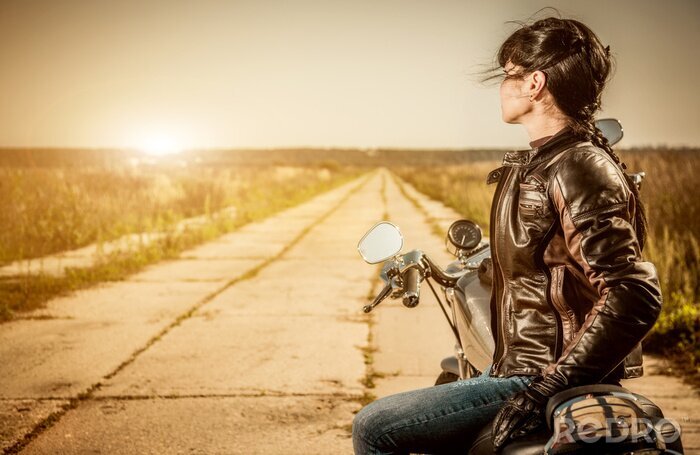 Poster Frau auf einem Motorrad