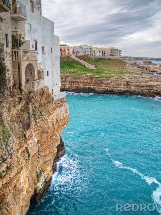Poster Haus auf einer Klippe am Meer