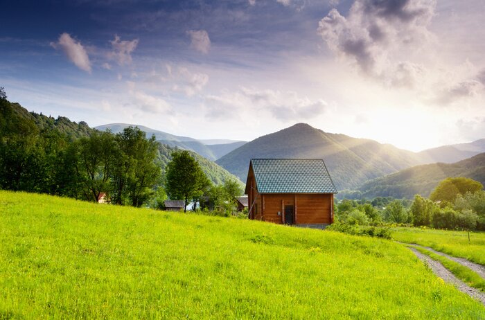 Poster Landschaft mit einer Holzhütte