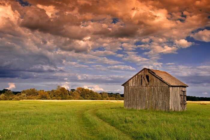 Poster Landschaft mit einer Holzscheune