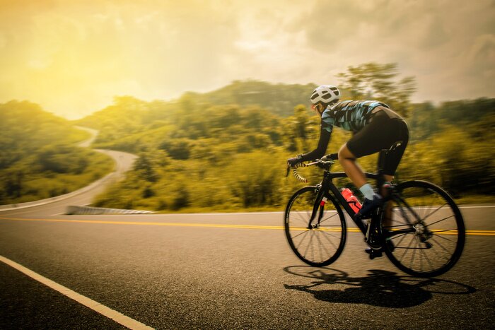 Poster Landschaft und Radfahrer in Bewegung